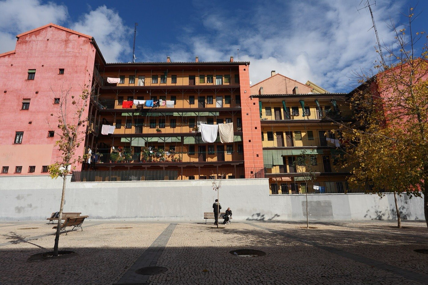 La Corrala de Sombrerete in Madrid: long shared balconies with washing hung out over a square
